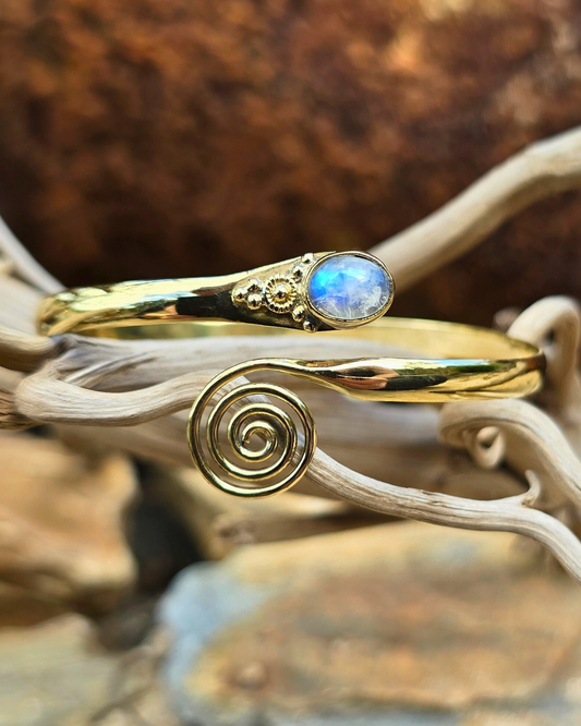 brass bracelet with swirl and moonstone gem