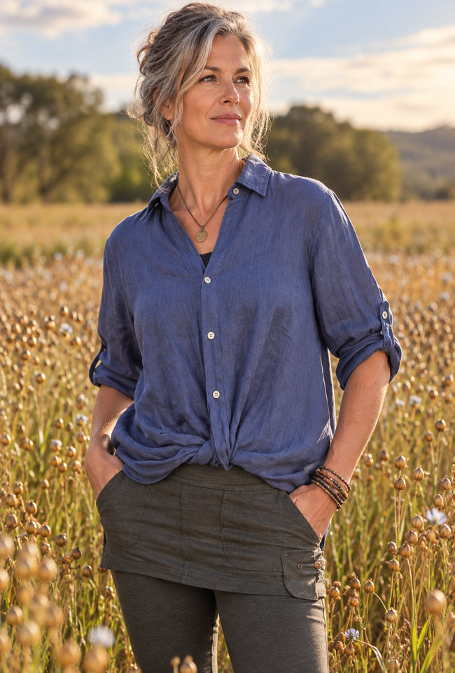 Freya Twist Top in blue linen with a front twist detail, button-up front and rolled sleeves.