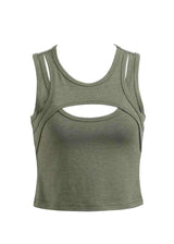 Green tank top with cut-out design on a white background