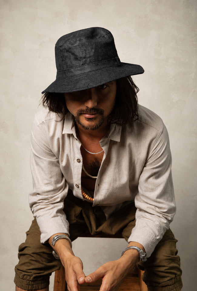 Black Hemp Fedora Hat featuring a classic fedora shape, breathable hemp fabric and wide sun-protective brim.
