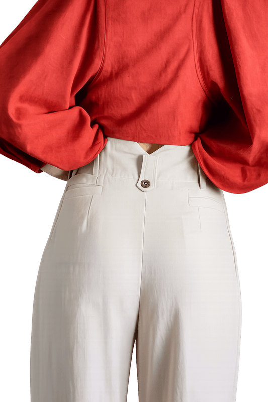 Red shirt and white pants against a white background