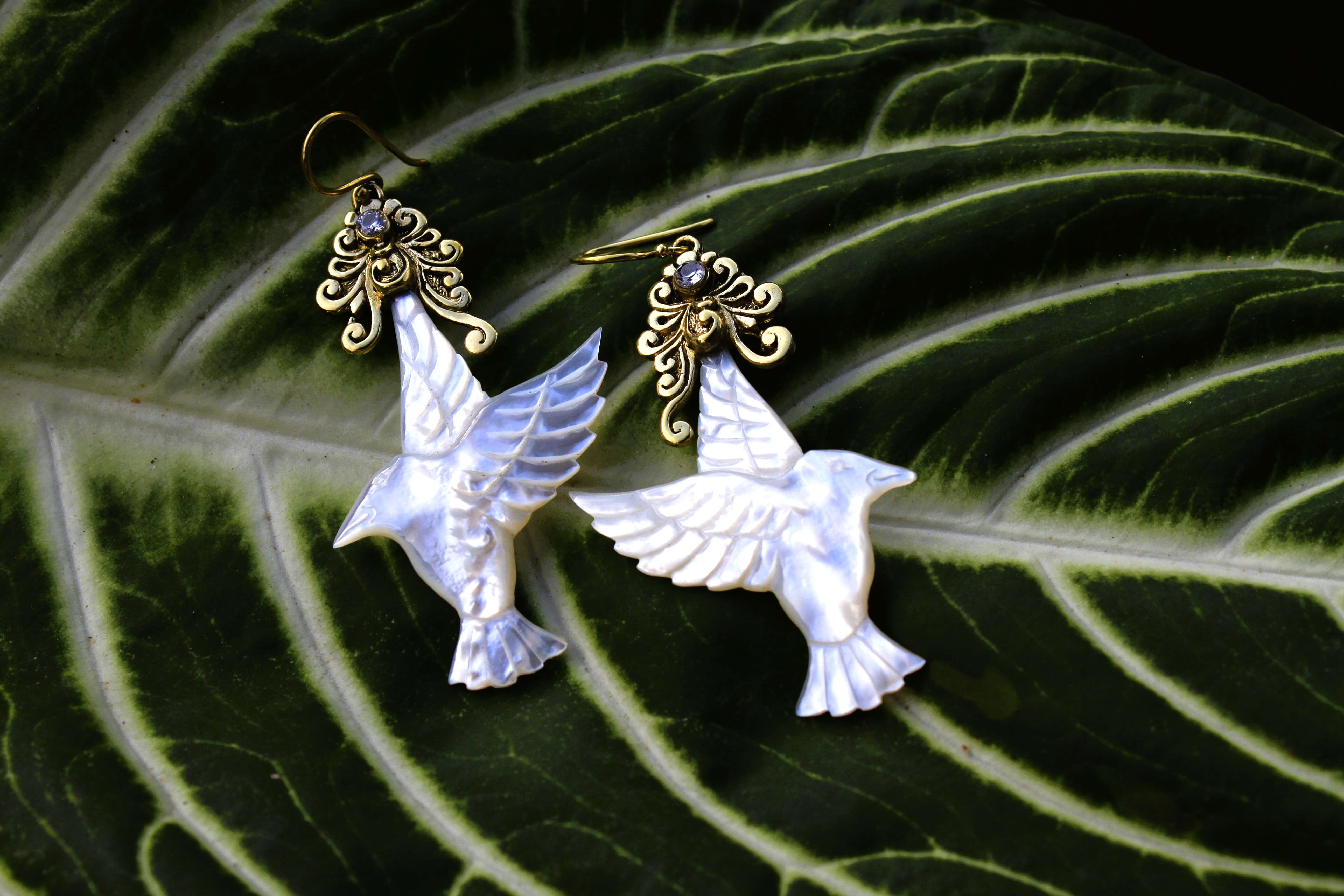 humming bird earrings carved from mother of pearl and brass findings