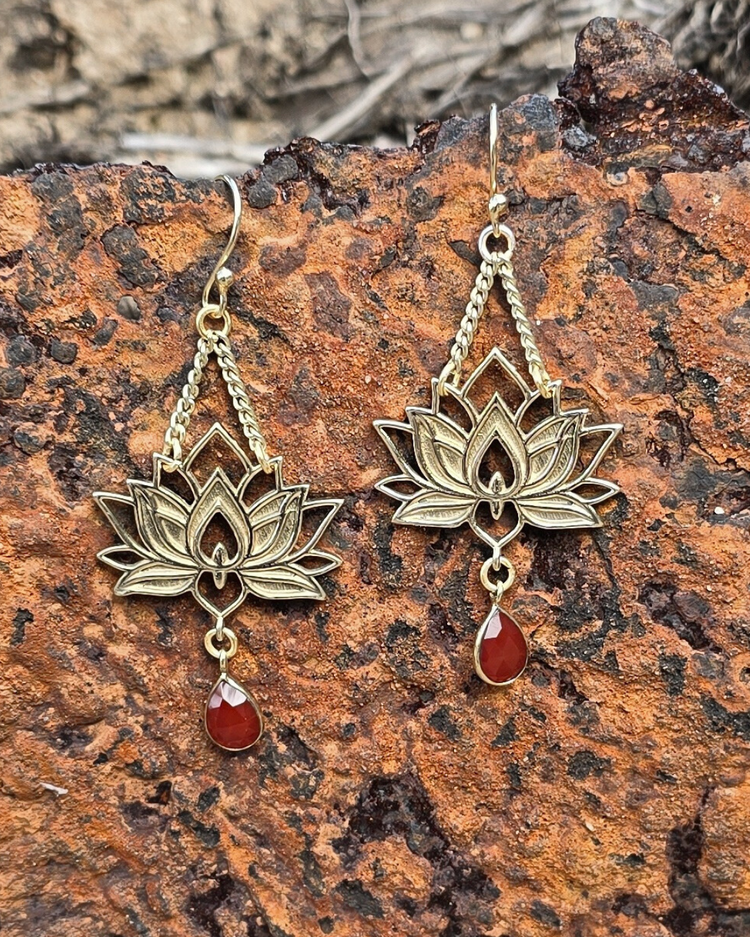 brass lotus float earring with garnet stone