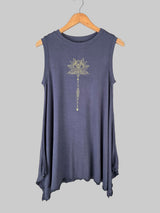 charcoal sleeveless top with a decorative design on a hanger against a tiled wall.