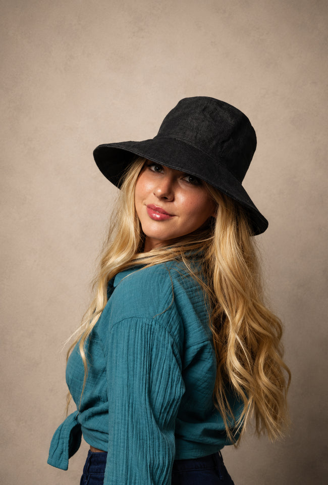 Meanderer Wide Brim Hat in black handwoven hemp with wave stitch detail and UV protection.
