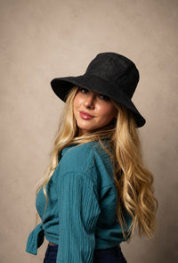 Meanderer Wide Brim Hat in black handwoven hemp with wave stitch detail and UV protection.