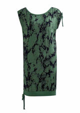 Green sleeveless dress with black abstract pattern on a white background