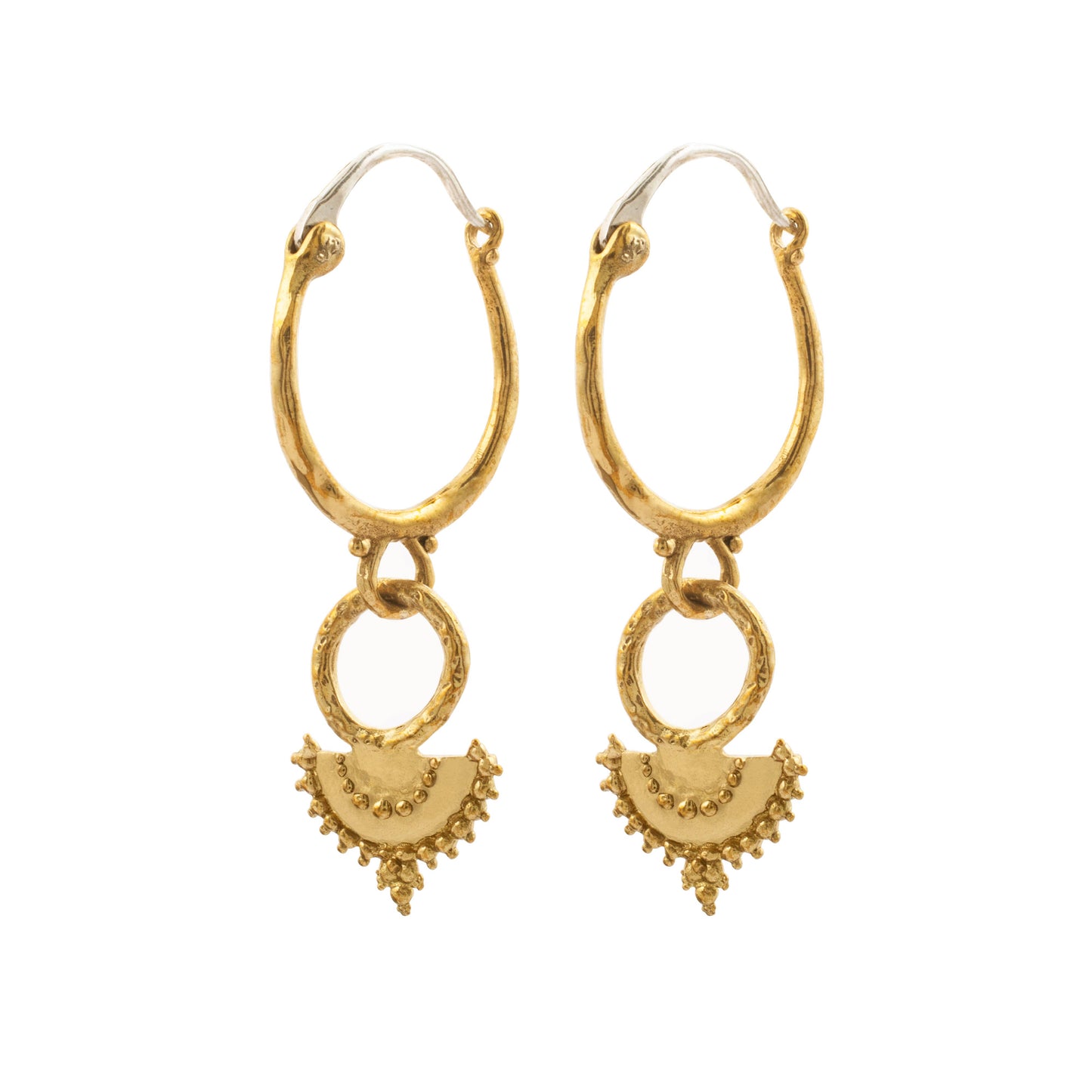 Naiyu Hoops worn as textured brass drop hoop earrings with sterling silver ear hooks