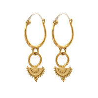 Naiyu Hoops worn as textured brass drop hoop earrings with sterling silver ear hooks