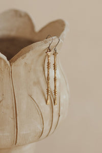 Nia Earrings - Brass pair of long textured drop earrings with ornamental detailing