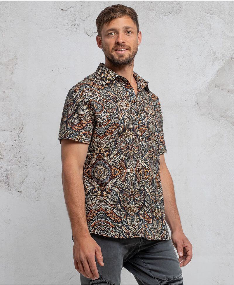 man in a psycadelic owl pattern button-up cotton shirt