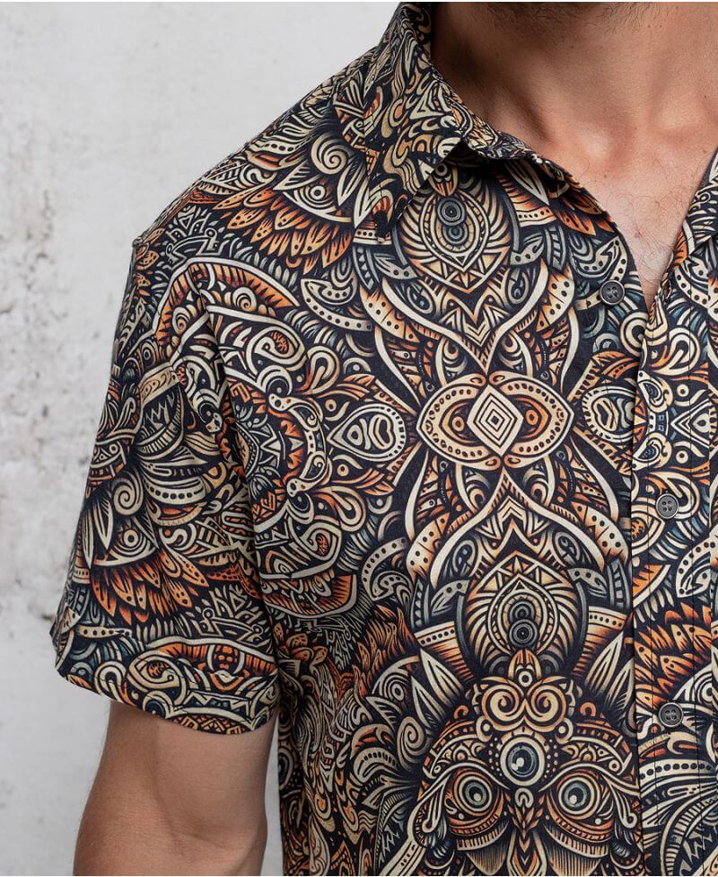 man in a psycadelic owl pattern button-up cotton shirt