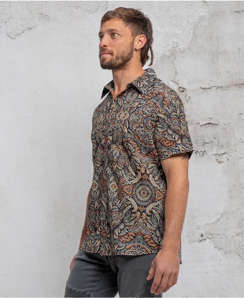 man in a psycadelic owl pattern button-up cotton shirt