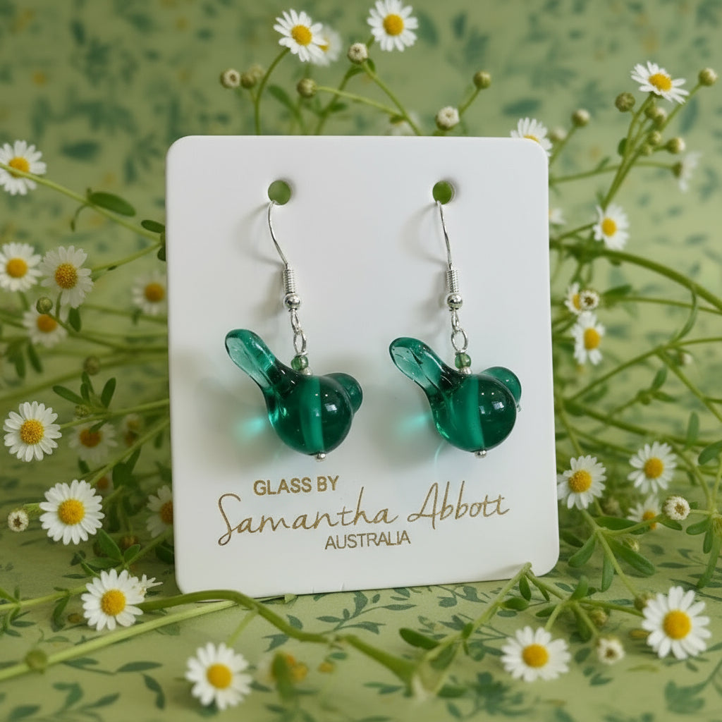 Green glass bird-shaped earrings on a branded card with 'Glass by Samantha Abbotti Australia' text.