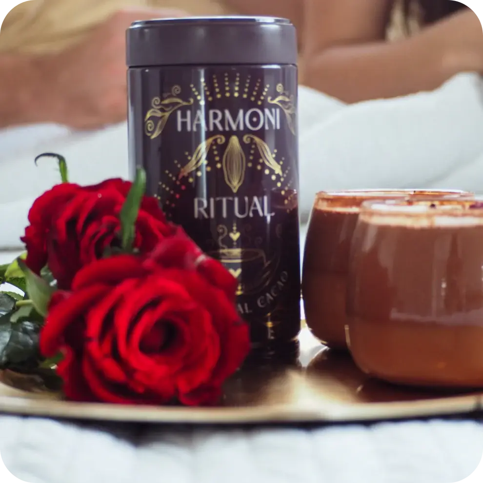 Harmoni Ritual product with red roses and a candle on a tray