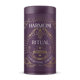 Purple canister with gold text and design on a white background