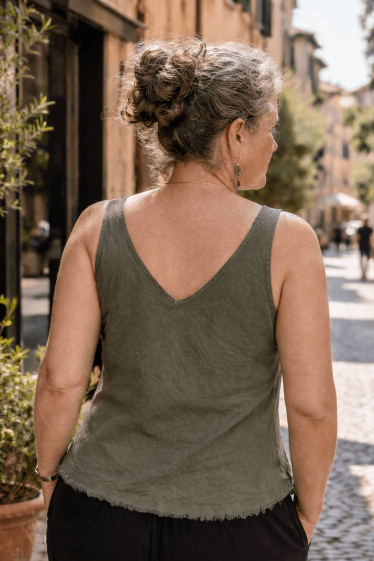 Woman walking down a street in an urban setting