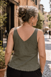 Woman walking down a street in an urban setting