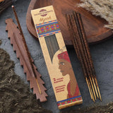 Incense sticks with packaging labeled 'Sacred Elements Myrrh' on a textured surface.