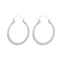 Shivani Hoops - White Brass large patterned hoop earrings on a white background