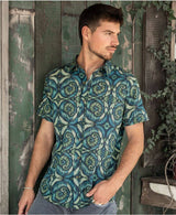 man wearing 100% cotton sprial leaves print button up shirt