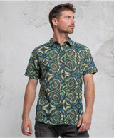 man wearing 100% cotton sprial leaves print button up shirt