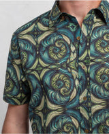 man wearing 100% cotton sprial leaves print button up shirt