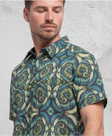 man wearing 100% cotton sprial leaves print button up shirt