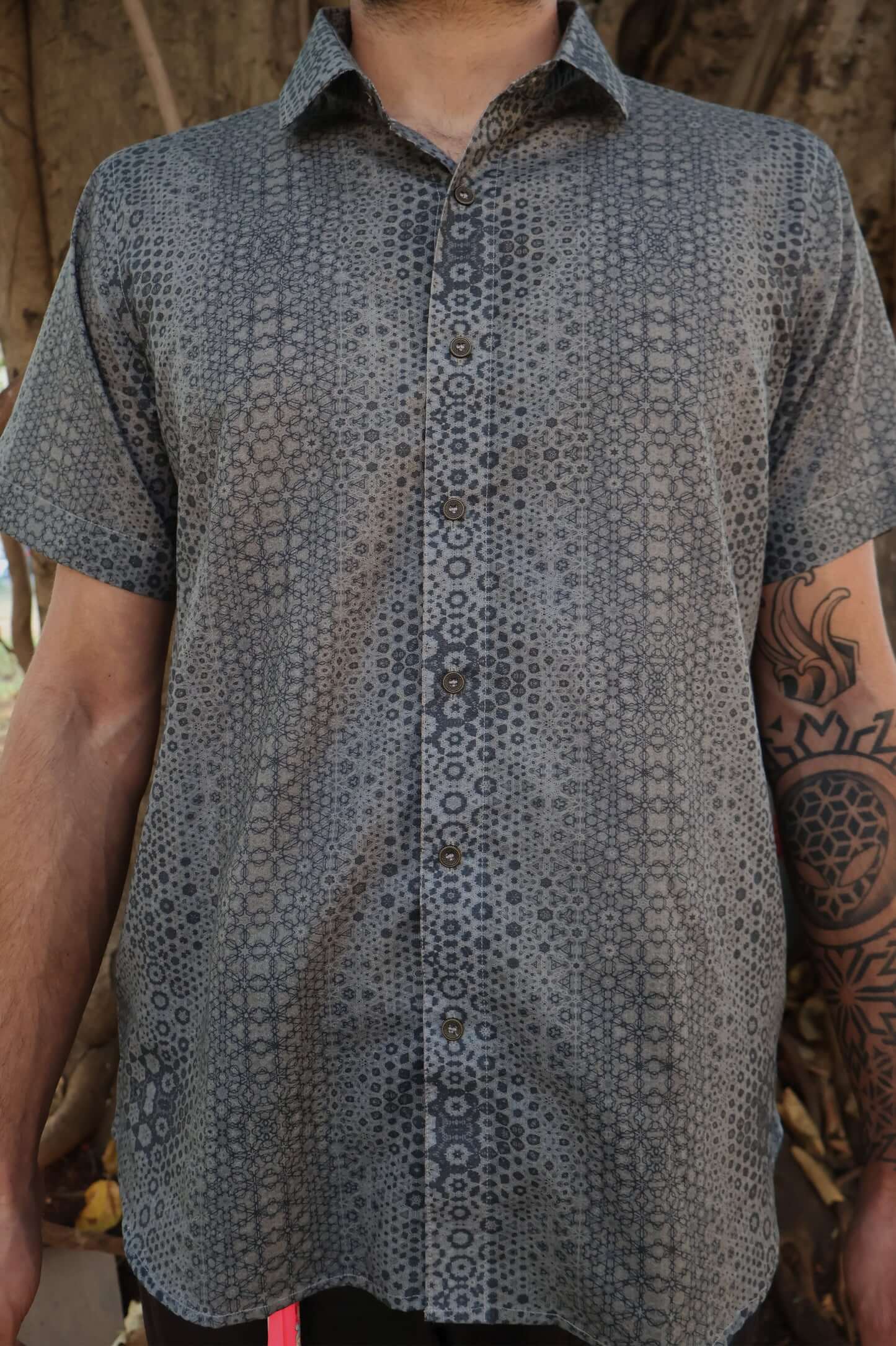 man in button up shirt with geometric print