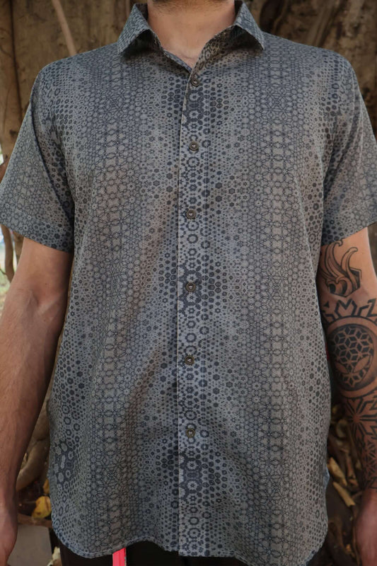 man in button up shirt with geometric print