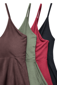 Four dresses in different colors (brown, green, red, black) on a black background