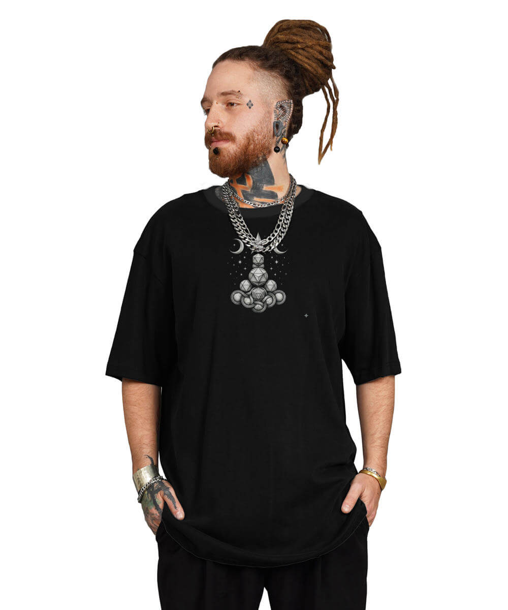 Man wearing a black t-shirt with a large necklace on a white background