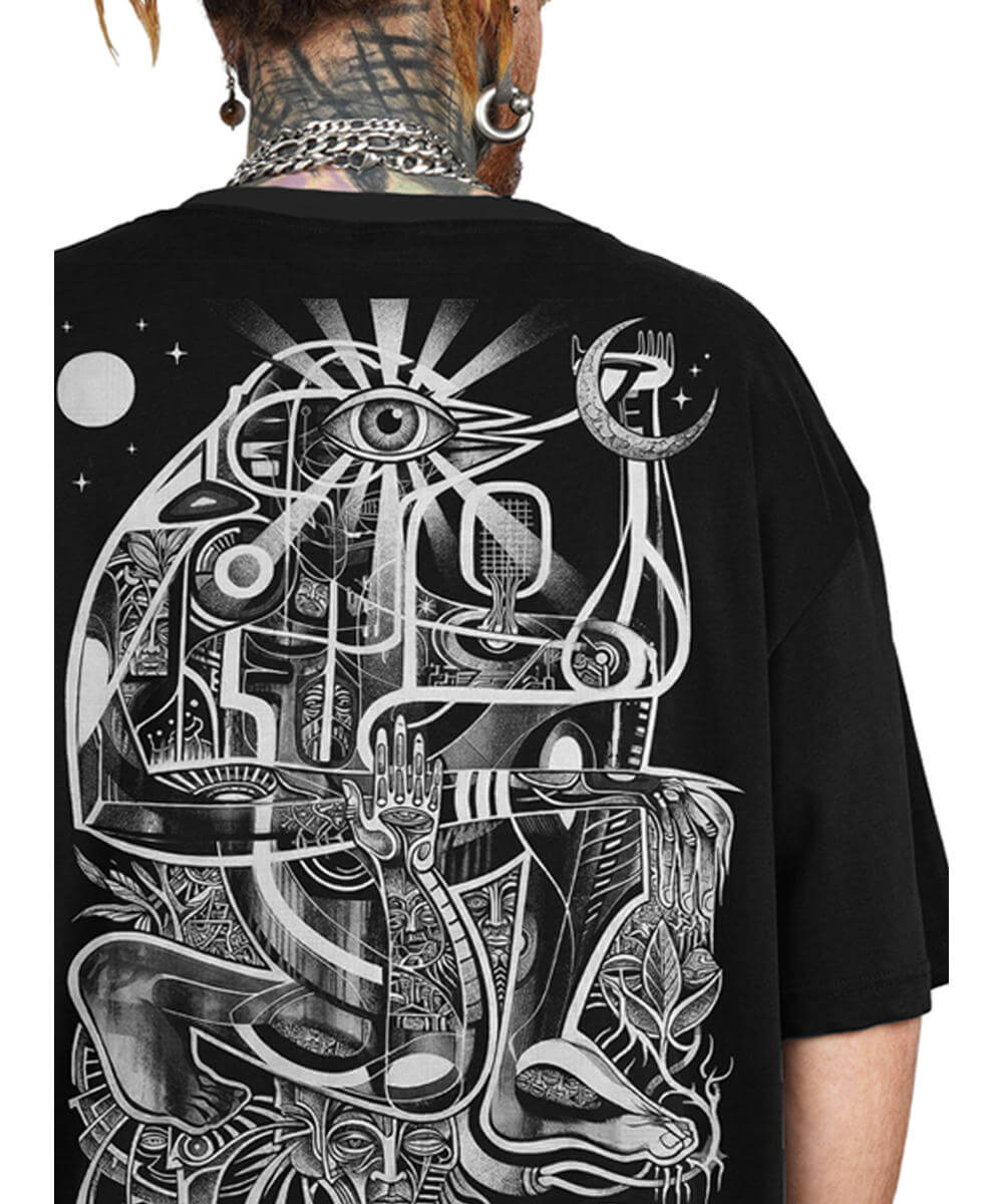 Black t-shirt with intricate white design on the back, worn by a person.