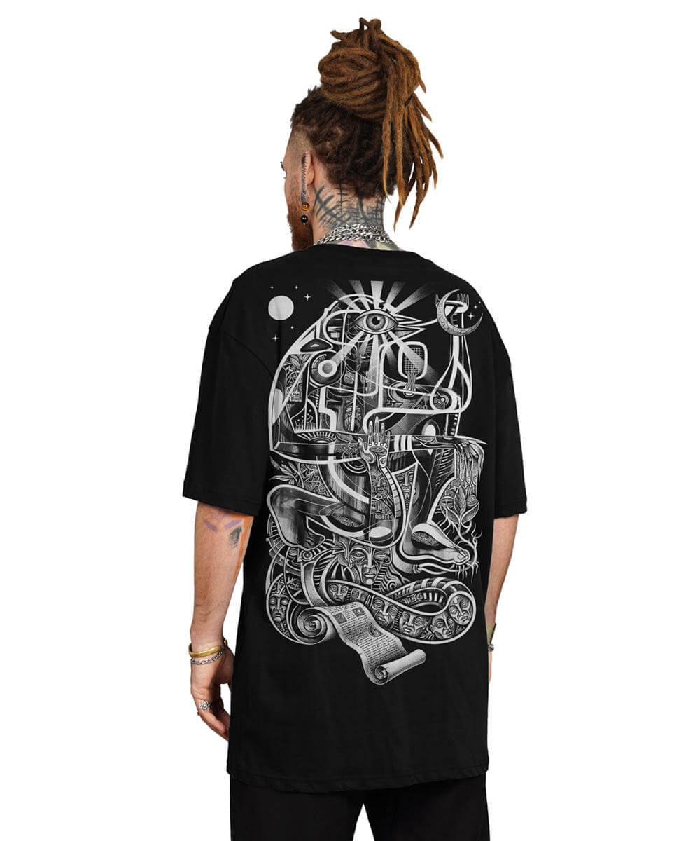 Person wearing a black t-shirt with a detailed white design on the back, standing against a white background.