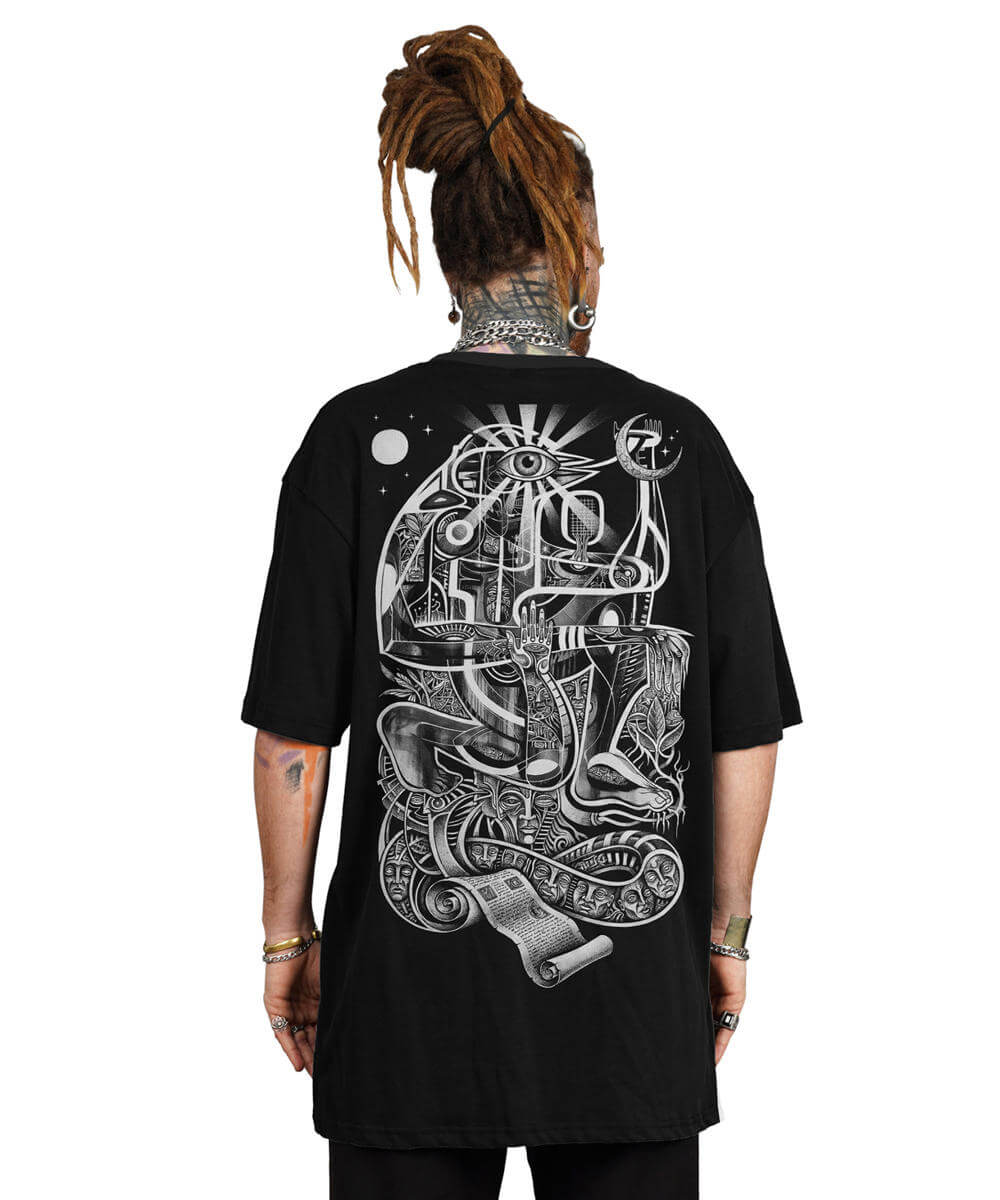 Person wearing a black t-shirt with intricate white graphic design on the back.