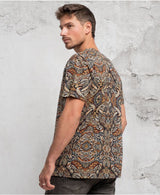 Men’s organic cotton T-shirt with psychedelic art, worn by model at music festival