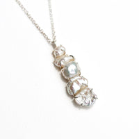White Pearl Cairns Necklace featuring five natural freshwater pearls on a delicate chain