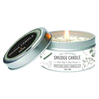 White Sage & Nag Champa Soy Smudge Travel Tin Candle burning in a silver travel tin