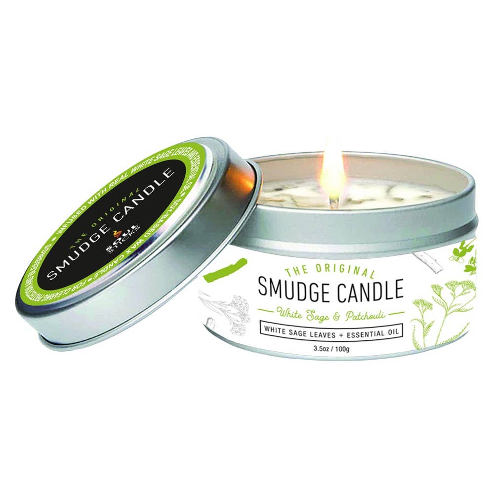 White Sage & Patchouli Soy Smudge Travel Tin Candle burning in a silver metal tin