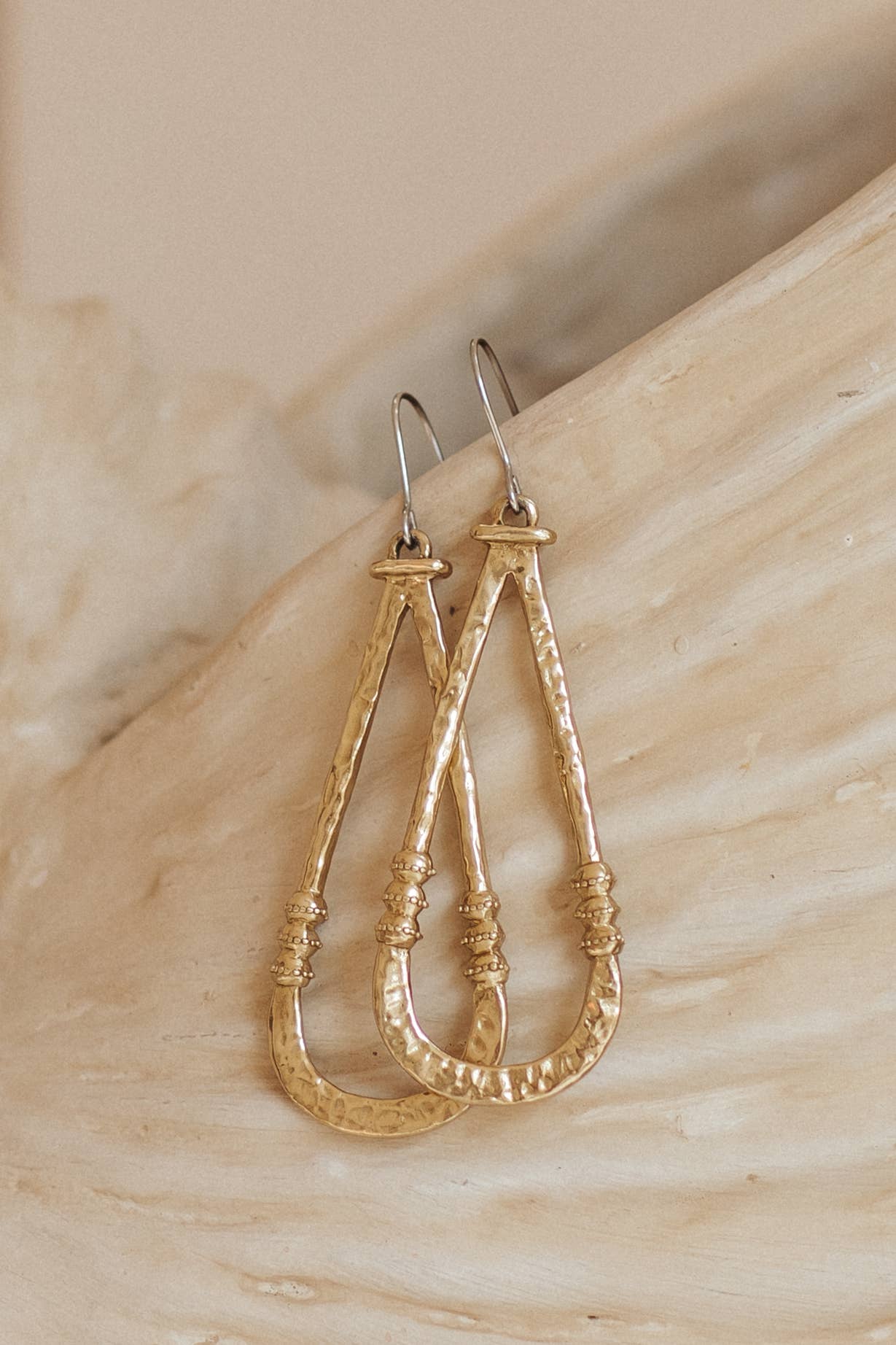 Zuri Earrings - Brass pair of long sculptural earrings with hammered texture